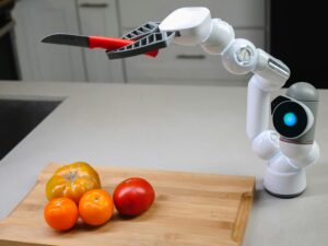 AI-powered-robotic-arm-slicing-tomatoes-on-a-kitchen-counter-symbolizing-artificial-intelligence-in-everyday-life